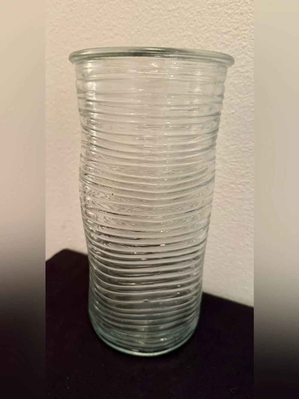 Ribbed glass vase, wavy, pinched shape. Mid-Century Modern design. 9.75”